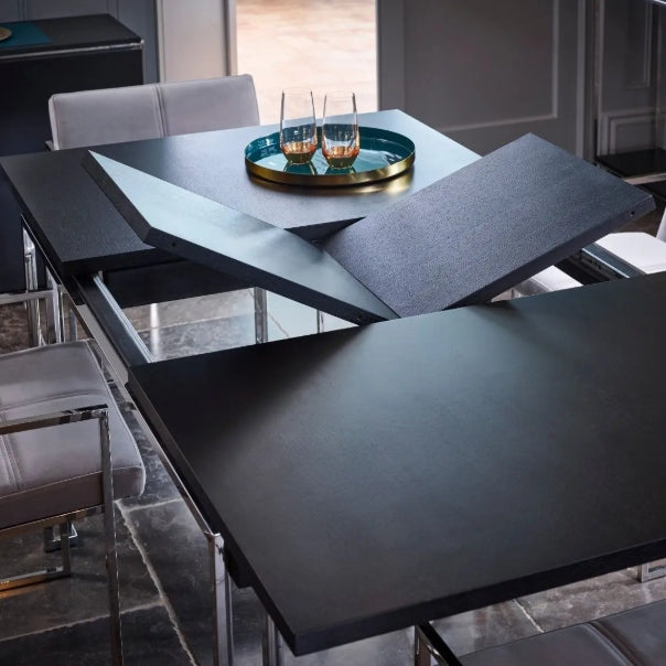 Dining table with a tray of glasses in a modern kitchen setting
